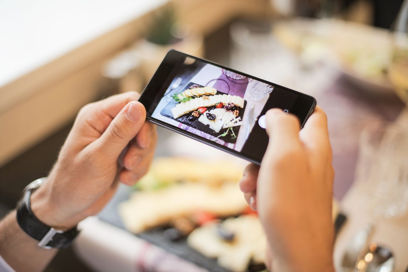 Photographing a beautifully arranged spread from above with a phone